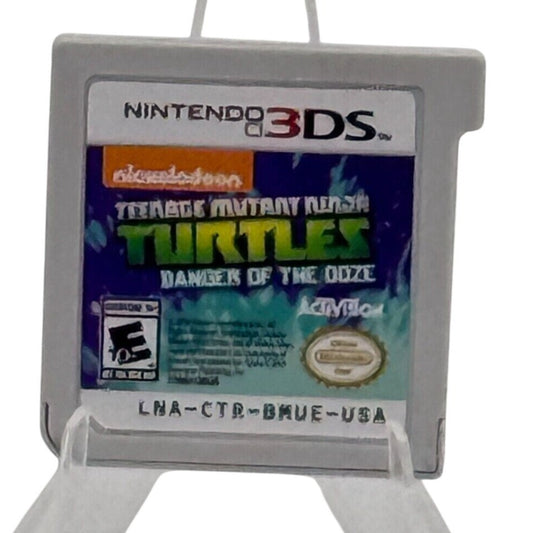 Teenage Mutant Ninja Turtles: Danger of the Ooze Nintendo 3DS game cartridge by Activision, rated E10+, based on the Nickelodeon animated series.
