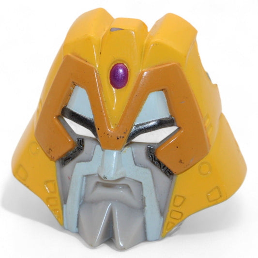 Transformers Armada Unicron face piece in yellow and gray, front view