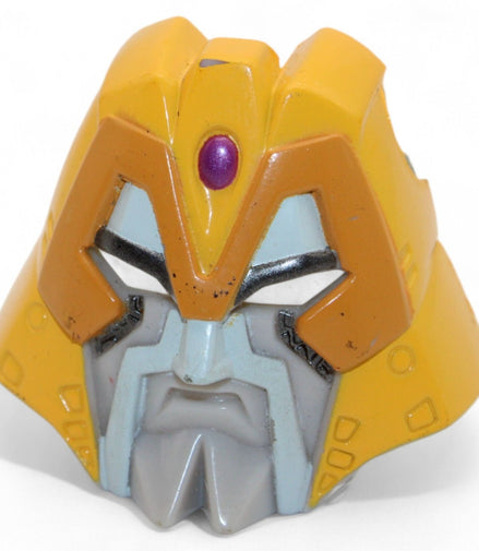 Transformers Armada Unicron face piece in yellow and gray, front view