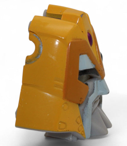 Side view of Transformers Armada Unicron face piece, yellow and gray