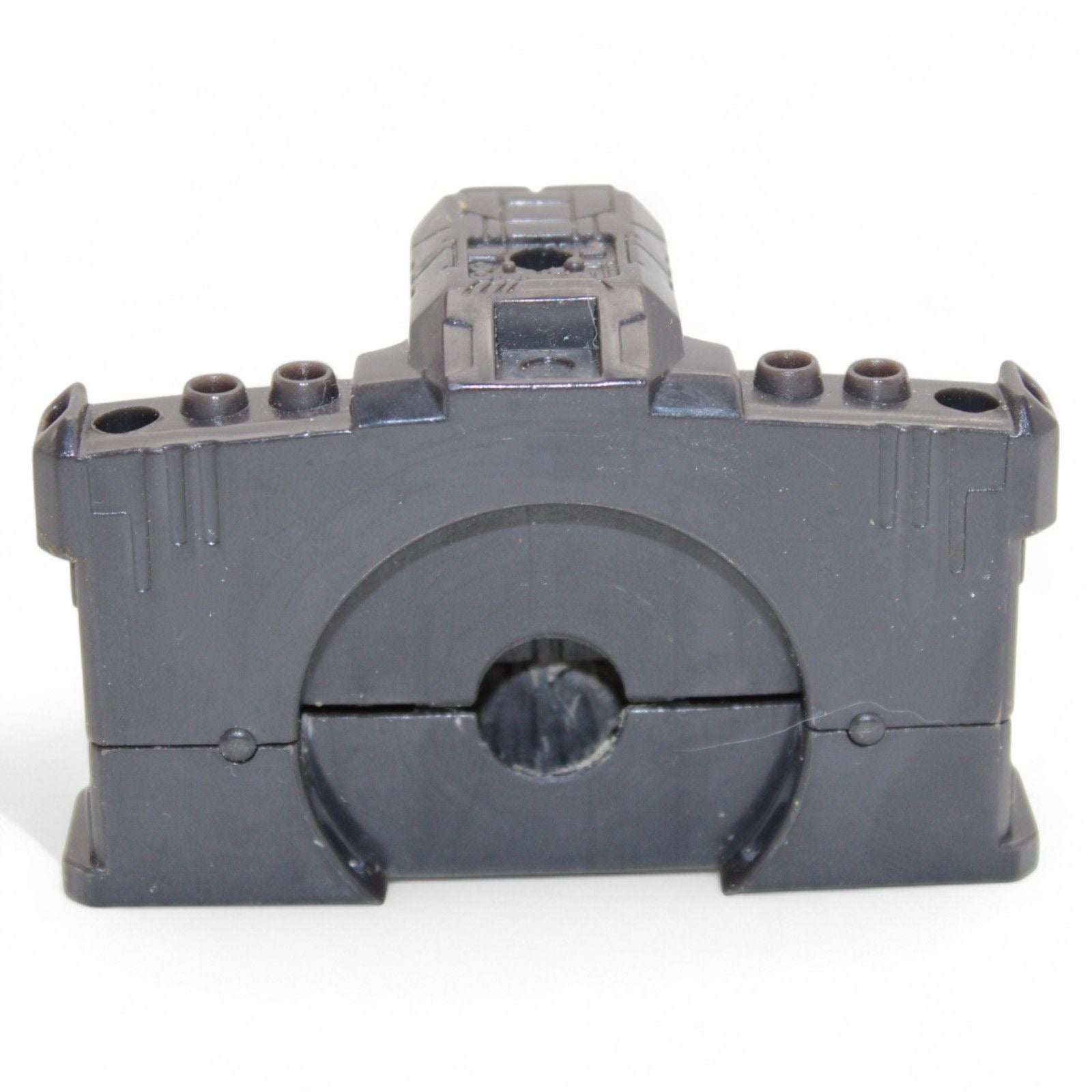 Close-up of durable black plastic hip section for Unicron