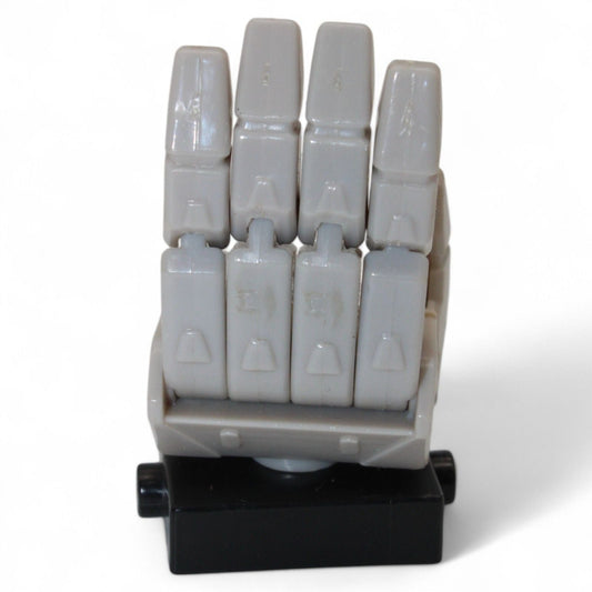 Transformers Armada Unicron left hand replacement part in gray and black plastic, front view