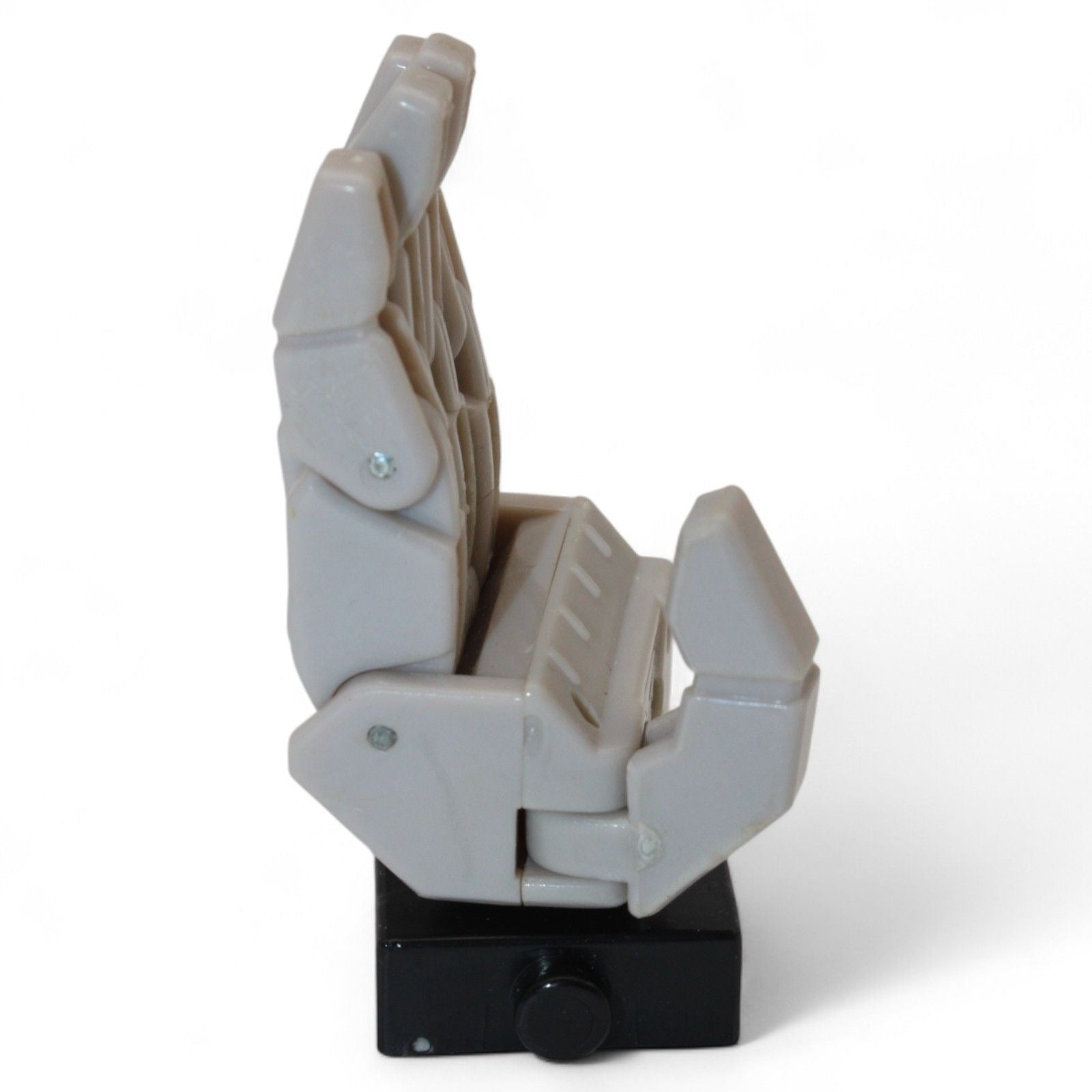 Side view of Transformers Armada Unicron left hand replacement part in gray and black