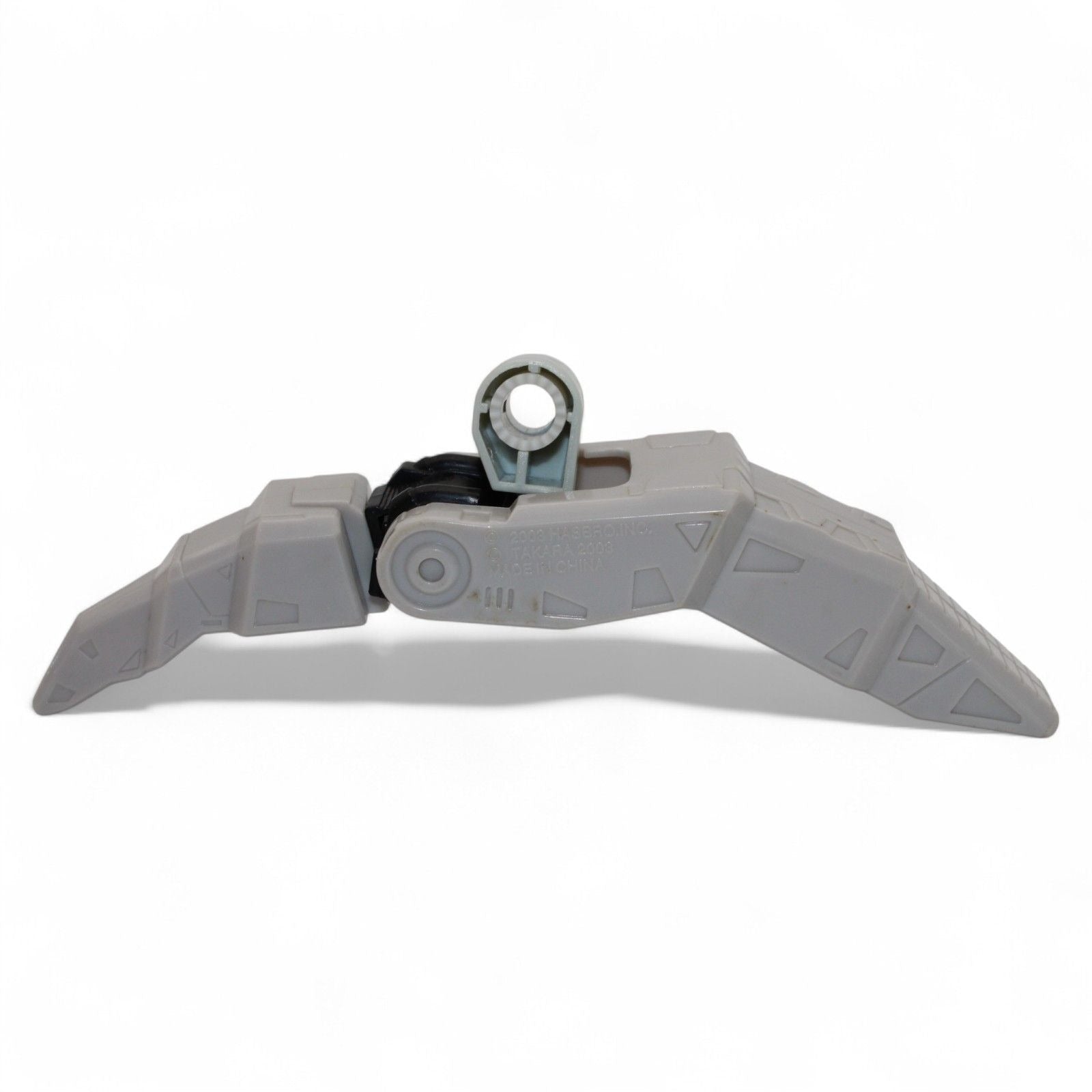 Gray plastic foot component for Transformers Armada Unicron, angled view