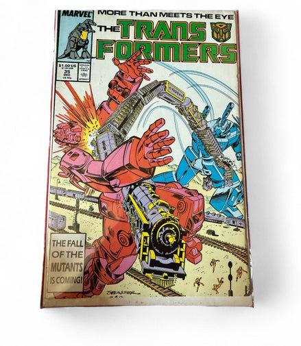 Transformers Comic Issue 35 cover featuring dynamic battle scene with Autobots and Decepticons