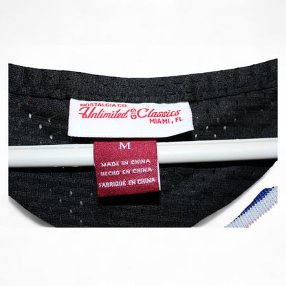 Close-up of the label on Tune Squad Lola #10 jersey showing size and brand