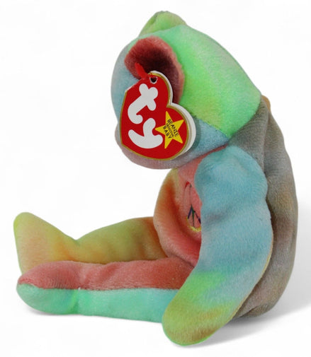 Side view of Ty Beanie Baby Peace Bear 1996 showing original tags