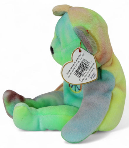 Side view of Ty Beanie Baby Peace Bear 1996 showing original hang tag