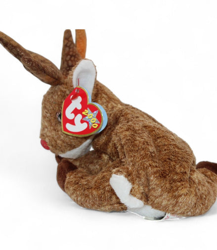 Side view of Ty Beanie Baby Roxie The Reindeer plush toy showing red nose and tags