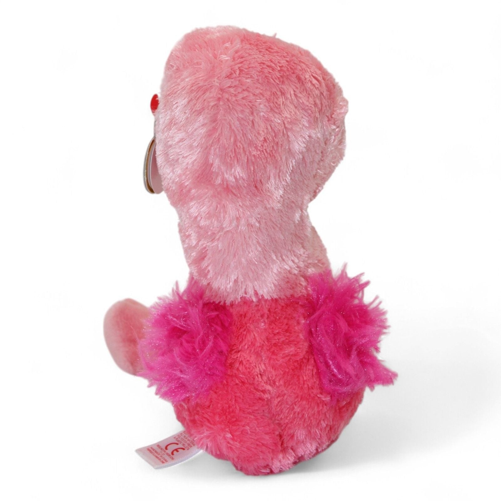 Back view of pink flamingo plush with fluffy wings