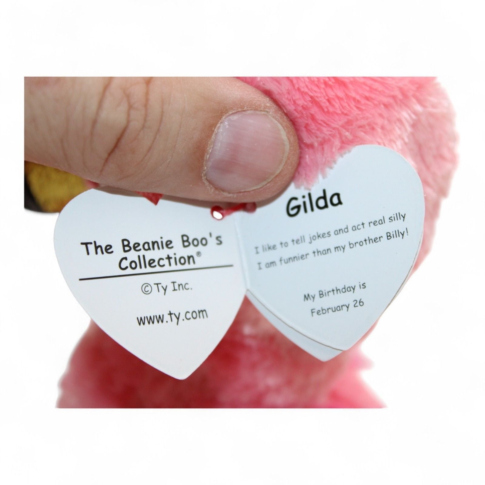 Gilda the flamingo plush tag showing birthday and details
