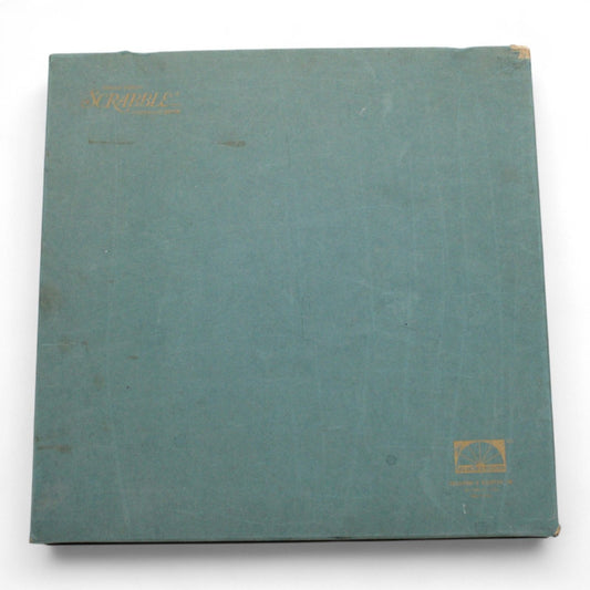 Vintage Scrabble board game by Selchow & Righter in original green box, mid-century edition with gold lettering, shows light wear from age.
