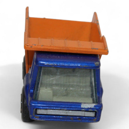 Side view of the vintage Lesney Matchbox Atlas Dump Truck showing its tilt bed
