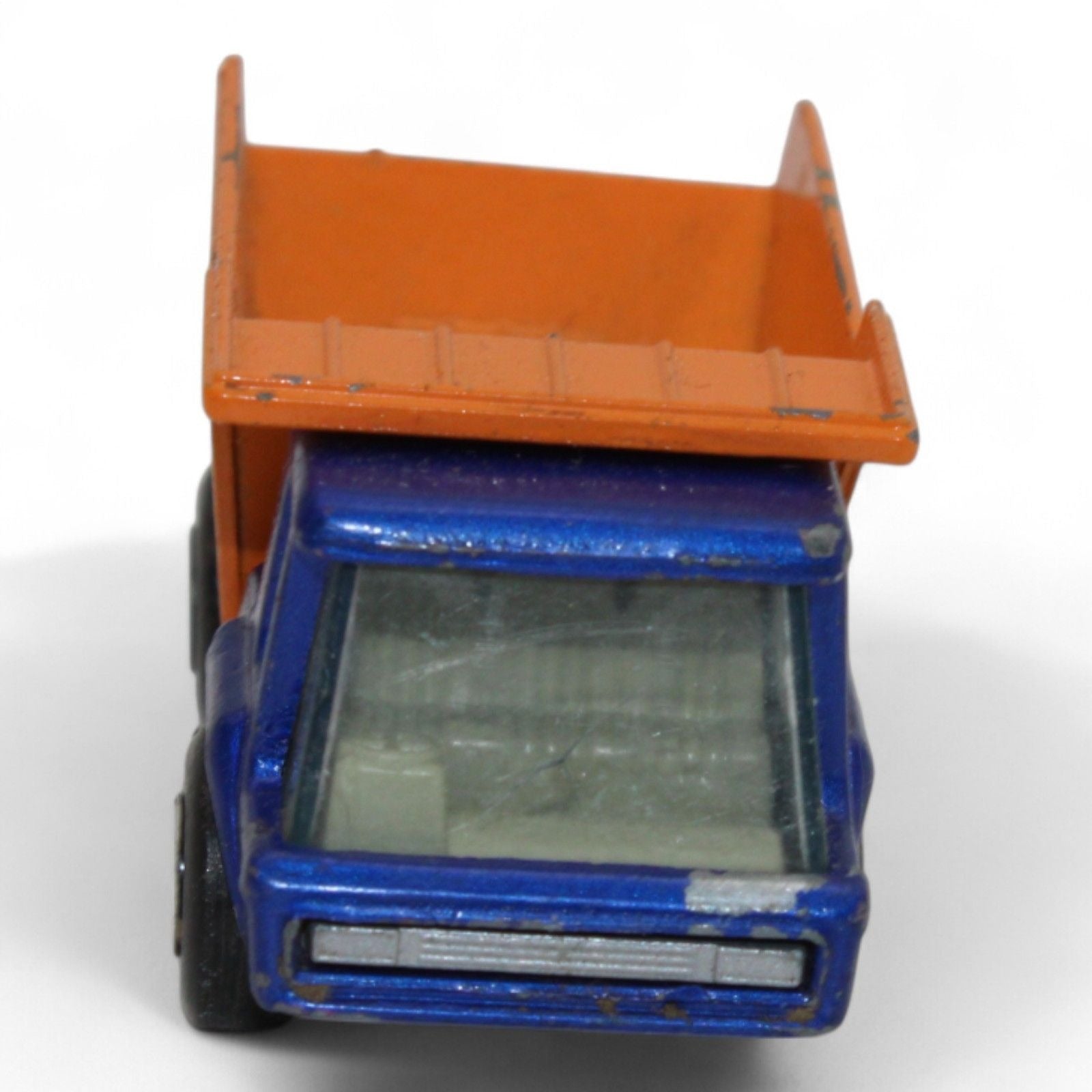 Side view of the vintage Lesney Matchbox Atlas Dump Truck showing its tilt bed