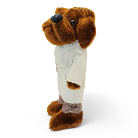 Side view of McGruff plush in trench coat