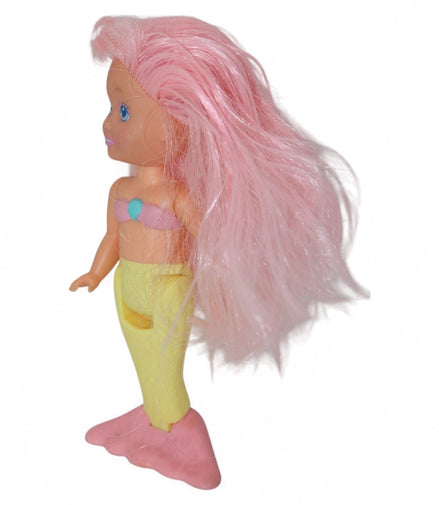 Side view of vintage Playskool mermaid doll with pastel colors
