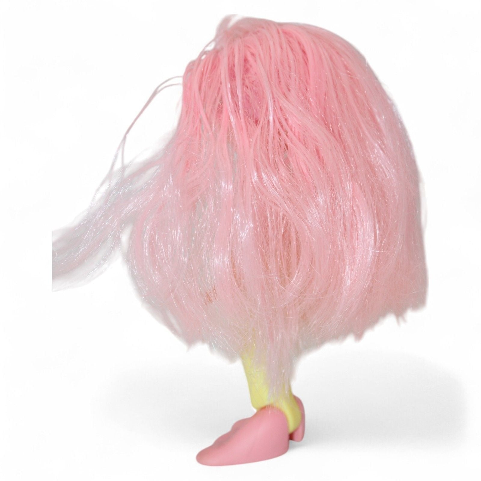 Back view of vintage mermaid doll showing pink hair