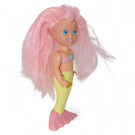 Charming vintage mermaid doll with pastel colors and pink hair