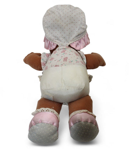 Back view of vintage baby doll with bonnet and dress