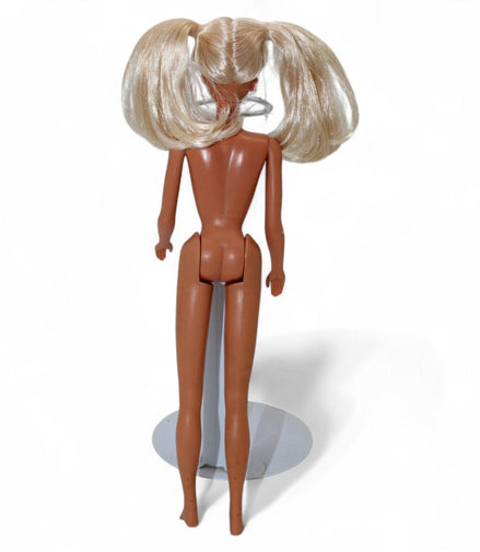 Back view of vintage Barbie doll with blonde pigtails