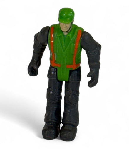 Vintage green and black toy soldier action figure standing upright