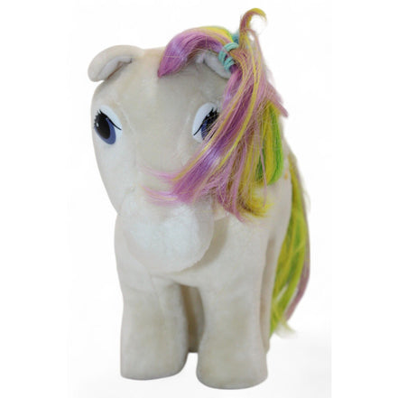 Side view of vintage Pegasus plush showing rainbow mane and star emblem
