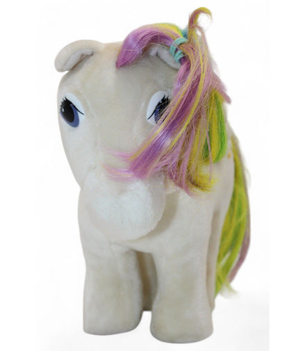 Side view of vintage Pegasus plush showing rainbow mane and star emblem