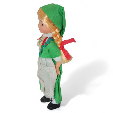 Side view of Irish doll with traditional attire and blonde braids