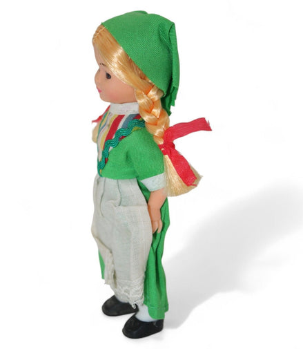 Side view of Irish doll with traditional attire and blonde braids