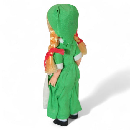 Back view of vintage Irish doll in green dress and headscarf