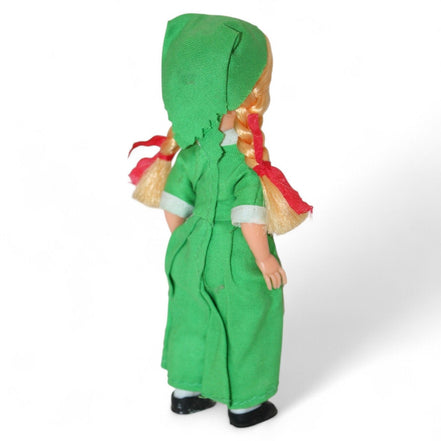 Irish doll showcasing traditional green dress and lace apron