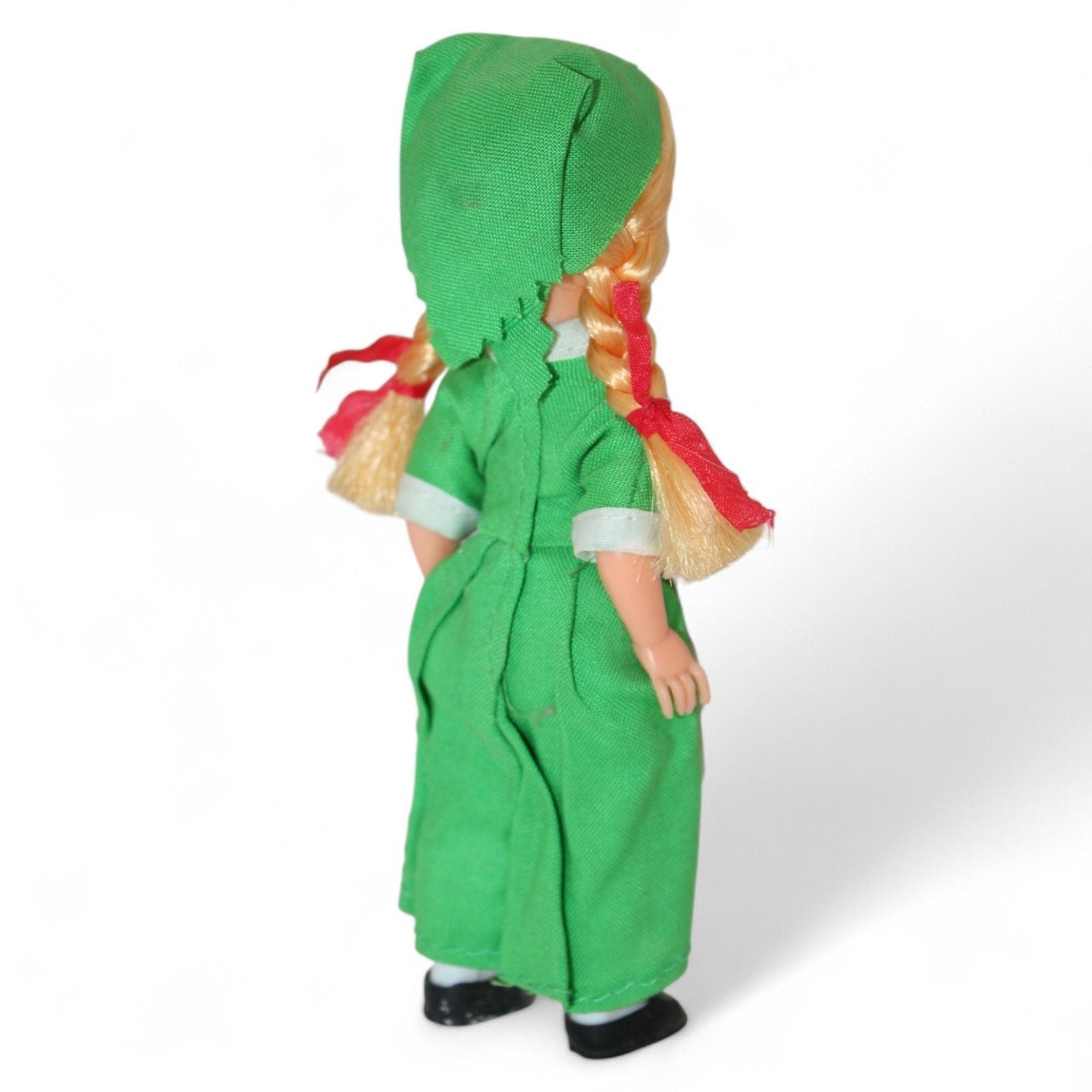 Irish doll showcasing traditional green dress and lace apron