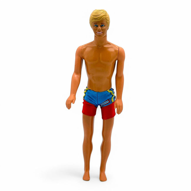 Vintage Ken doll with blonde molded hair and red blue swim trunks