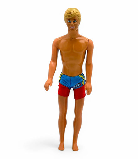 Vintage Ken doll with blonde molded hair and red blue swim trunks