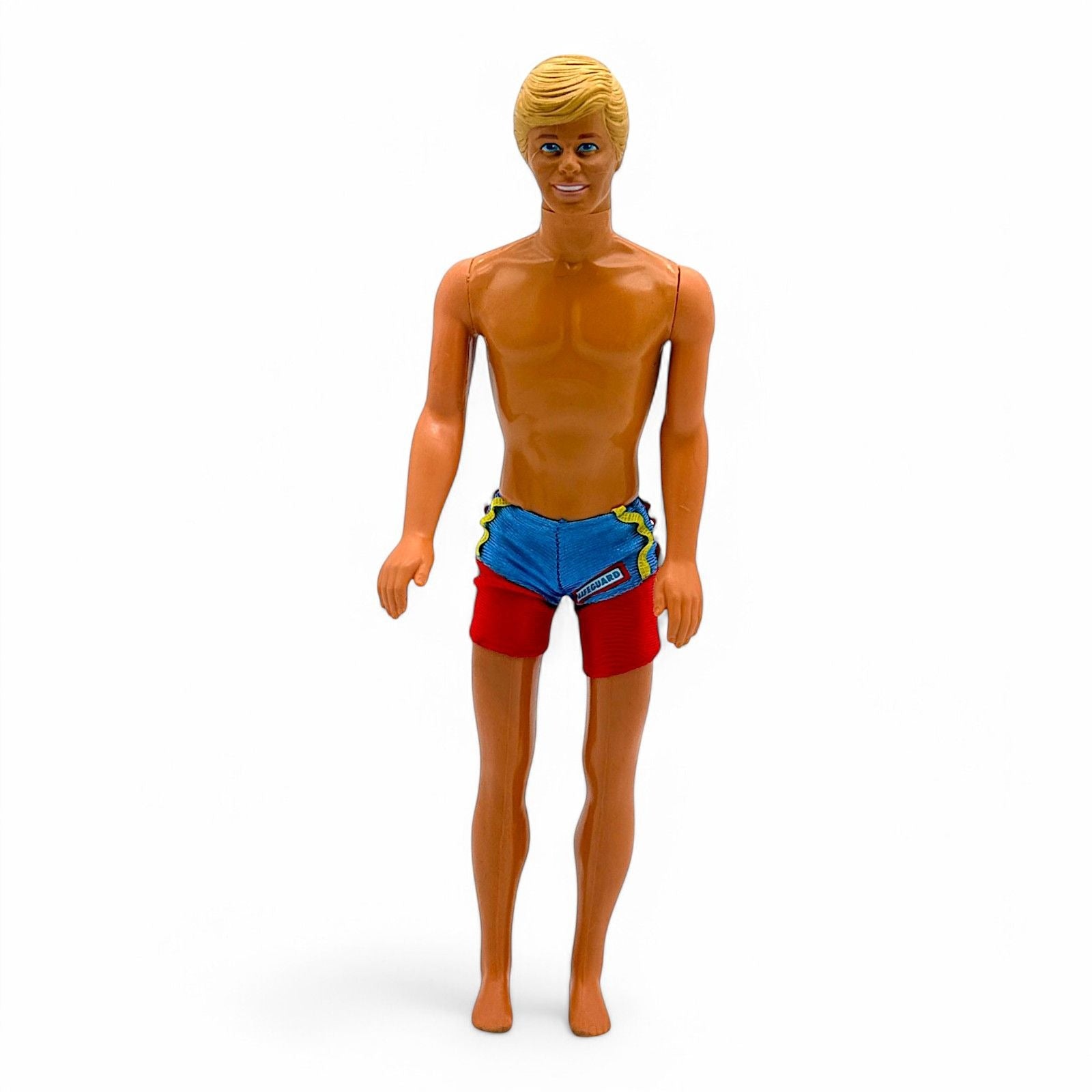 Side view of vintage Ken doll in swim trunks