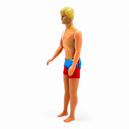 Back view of vintage Ken doll showing swim trunks