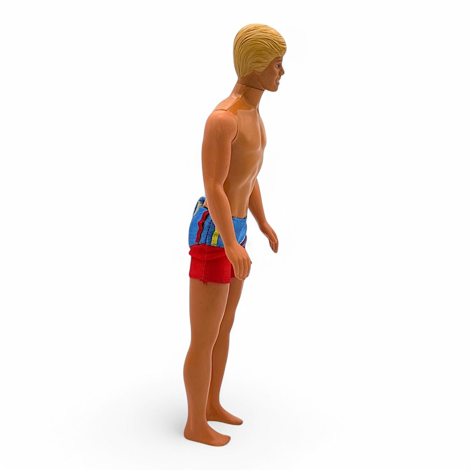 Vintage Ken doll with blonde molded hair and red blue swim trunks