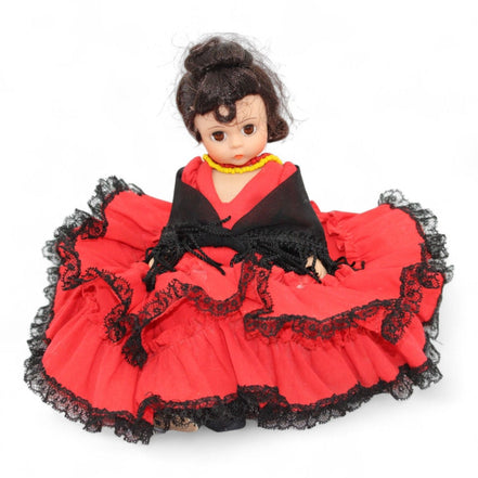 Front view of Vintage Madame Alexander Spain Doll in red dress