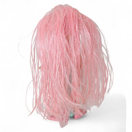 Back view of vintage mermaid doll showing pink hair