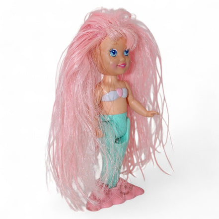 Vintage mermaid doll with pink hair and glittery tail, side angle