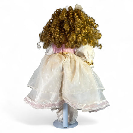 Back view of vintage doll with curly hair