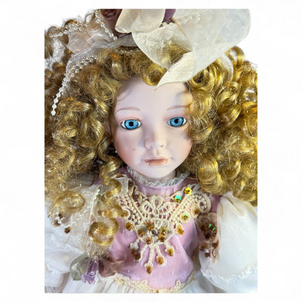 Close-up of vintage doll's face with curly hair