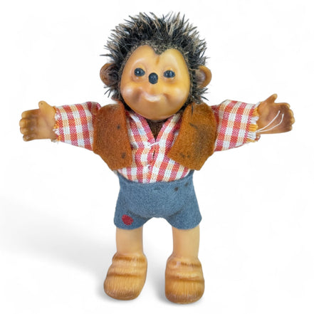 Vintage Steiff hedgehog rubber toy with plaid outfit