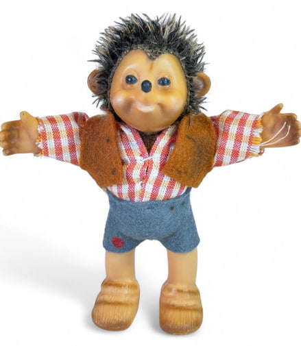 Vintage Steiff hedgehog rubber toy with plaid outfit