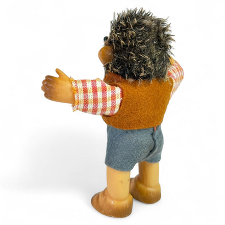 Back view of Steiff hedgehog collectible with vest