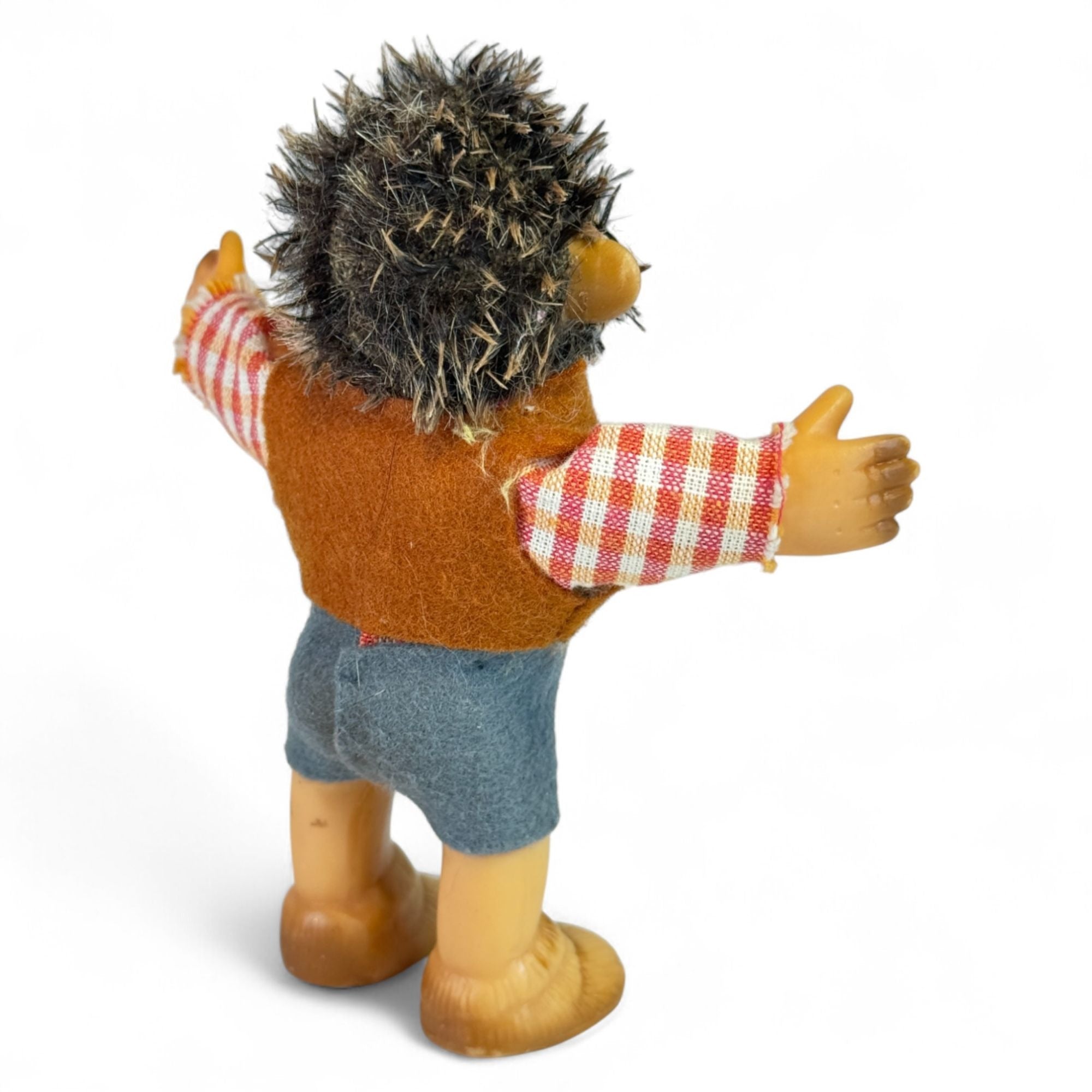 Vintage Steiff hedgehog toy showing plaid and vest details