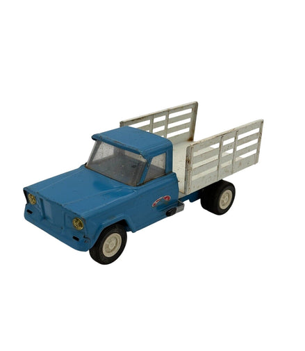 Side view of vintage Tonka blue stake truck with white bed