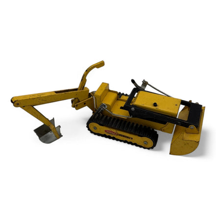 Vintage Tonka Trencher diecast metal excavator toy with yellow and black details