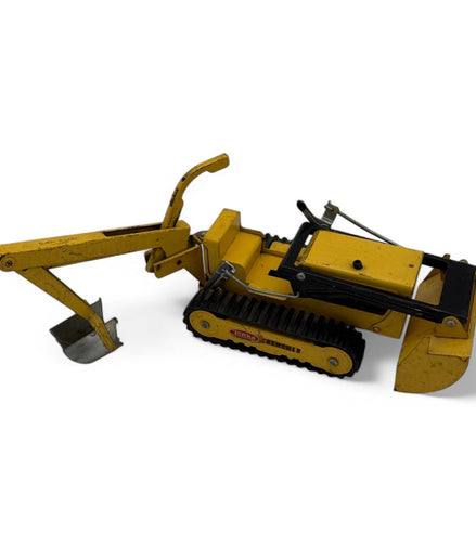 Vintage Tonka Trencher diecast metal excavator toy with yellow and black details