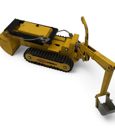 Side view of Tonka Trencher toy showing excavator arm and tracks